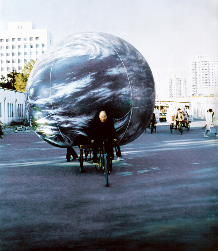 Seung-taek Lee,&nbsp;The Earth Touring Beijing, 1994. Performance documentation, paint on C-print, 35.83 x 44.88 inches.Courtesy of Gallery Hyundai. 